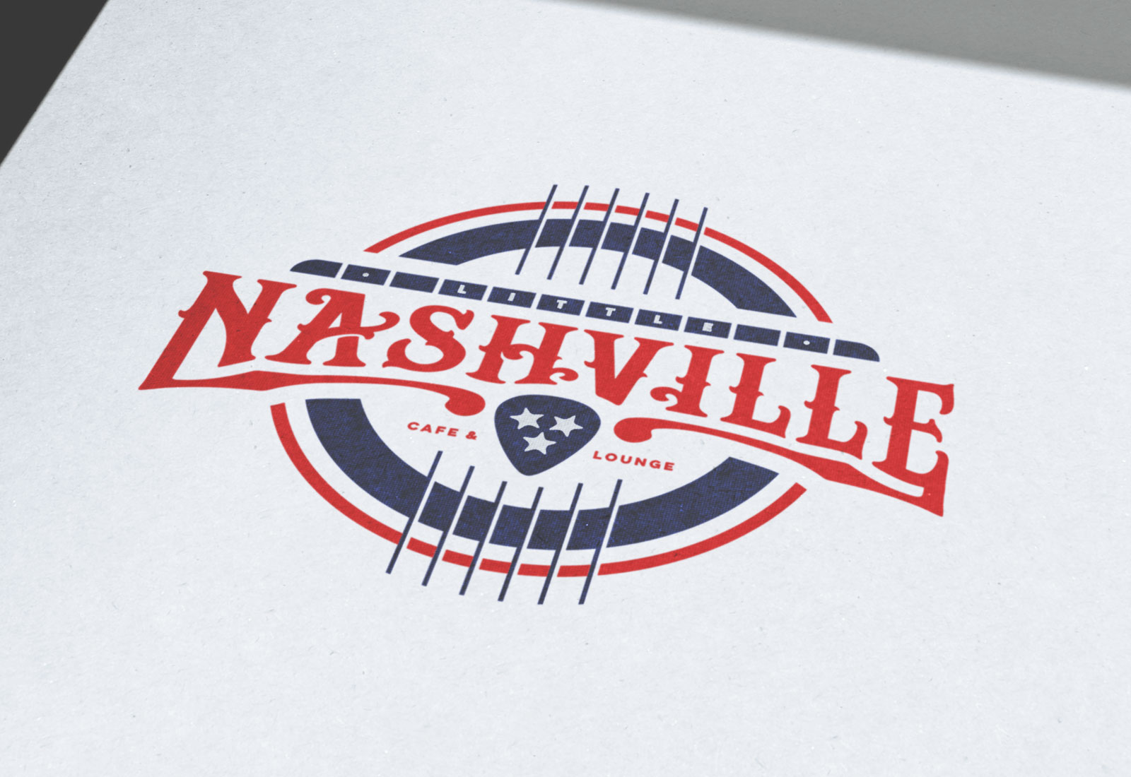 Little Nashvill Logo Design On Printed Paper